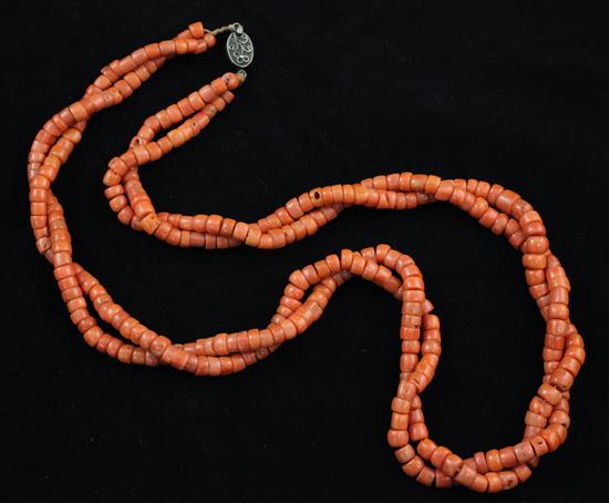 A Chinese double strand coral bead necklace, 24in.